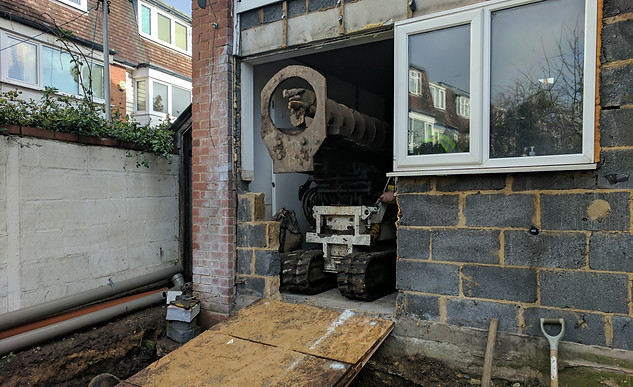 Restricted access piling rig operating inside house